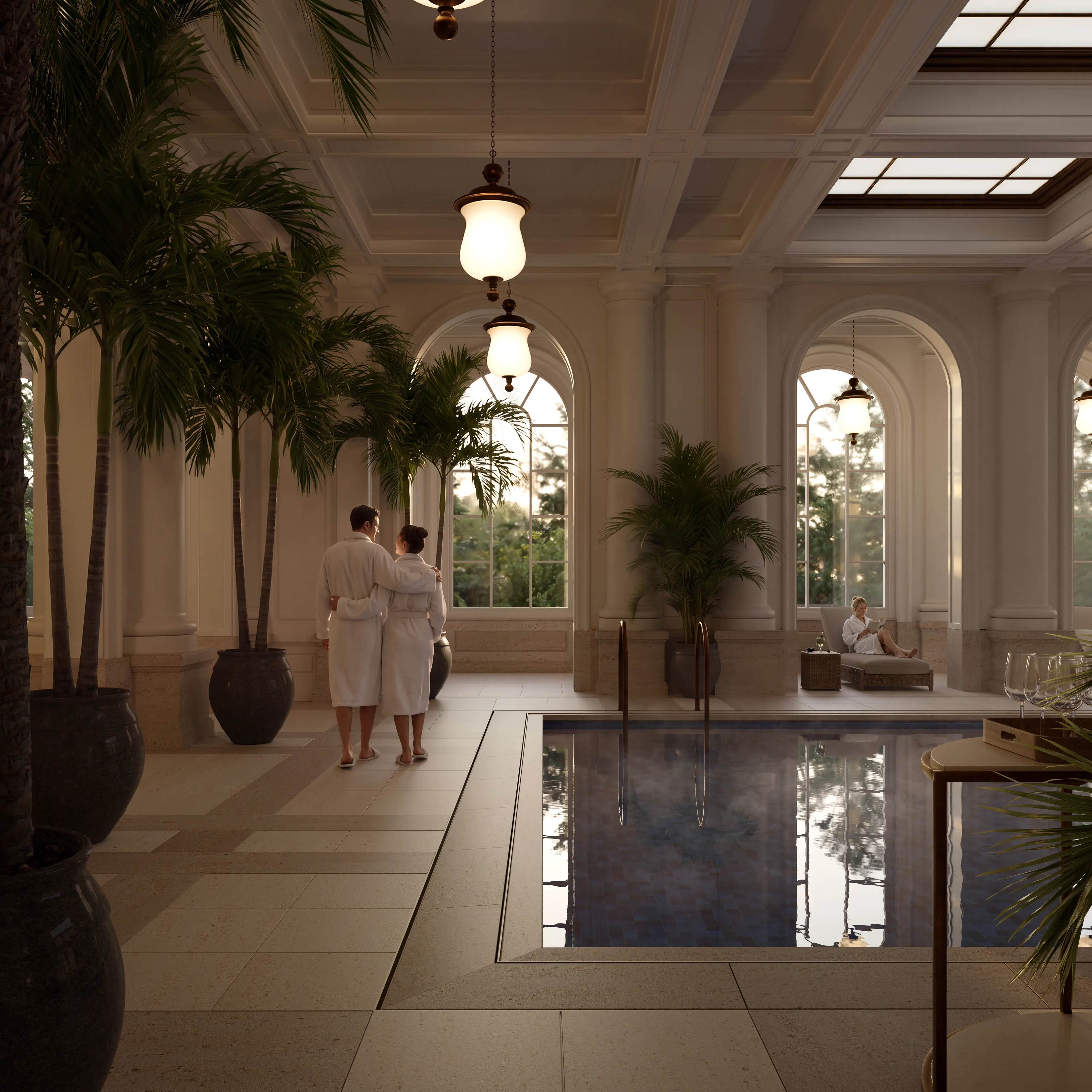 Indoor pool with guests in robes